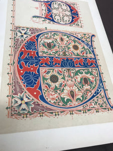 Closeup of bookplate featuring illuminated letters